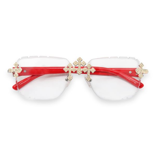 Red sunglasses with gold decorative elements on a white background