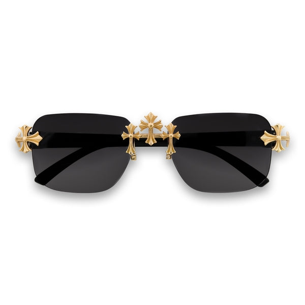 Sunglasses with gold cross-shaped temple tips on a white background