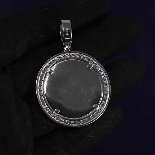 Silver pendant with gemstones on a dark background