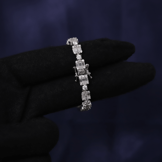 Diamond bracelet held by a gloved hand against a dark background
