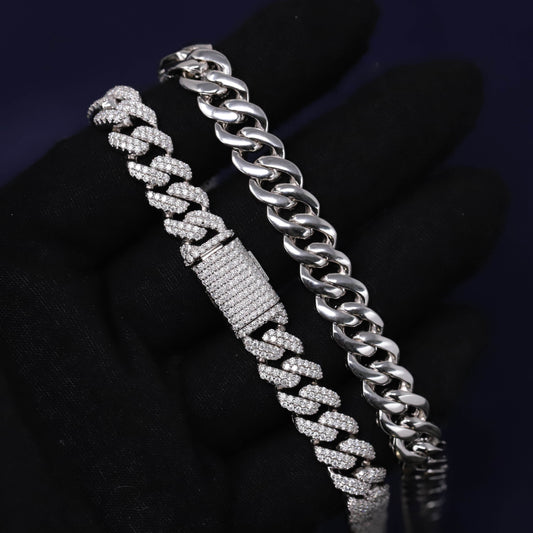 Silver chain bracelet with diamond-like stones on a dark background