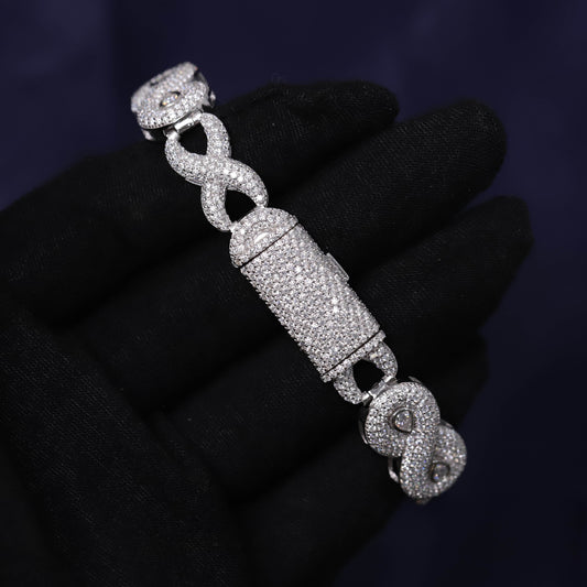 Silver bracelet with intricate design on a dark background