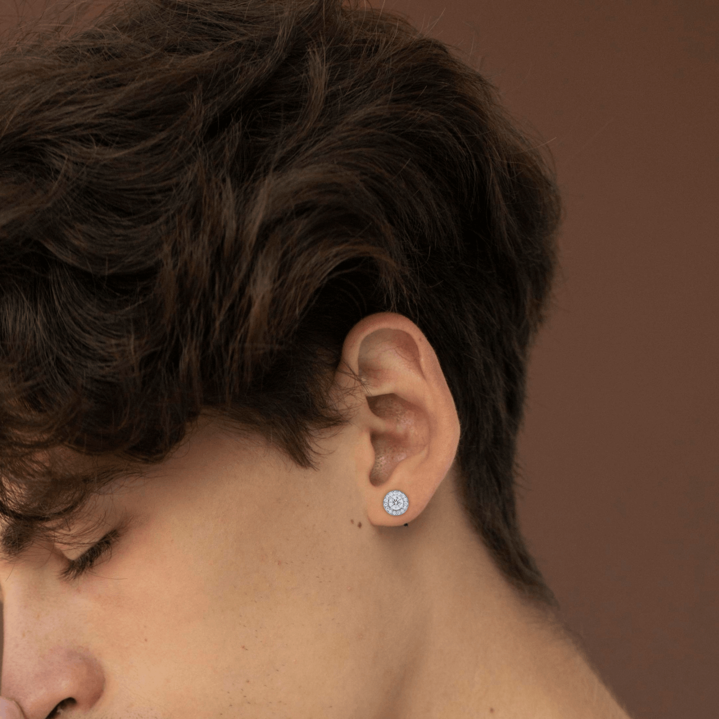 7mm round moissanite cluster diamond stud earring worn on ear.