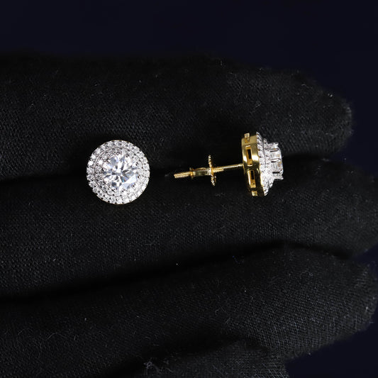 Pair of diamond stud earrings on black fabric