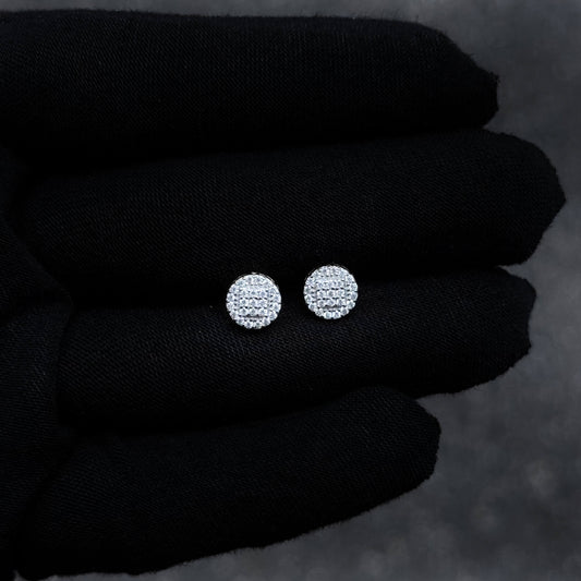Small 7mm sterling silver moissanite cluster stud earrings displayed on black glove for detail view.
