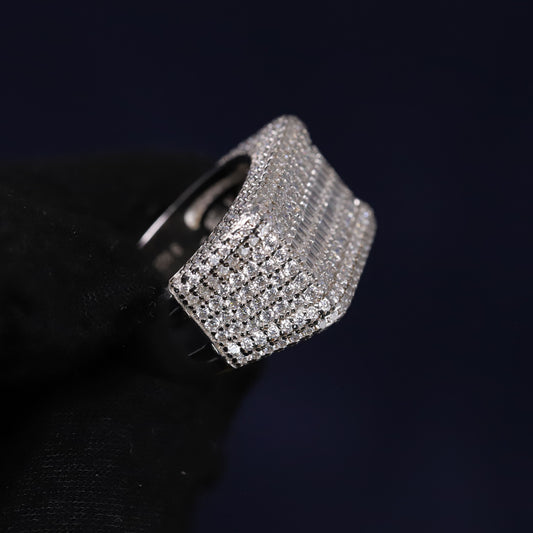 Silver ring with gemstones on a black background