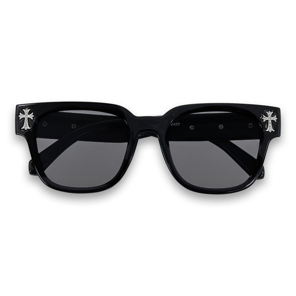 Black sunglasses with cross designs on a white background