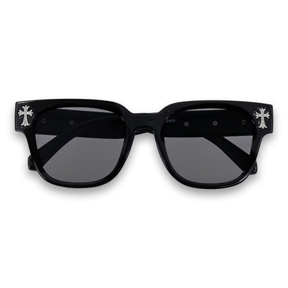 Black sunglasses with cross designs on a white background