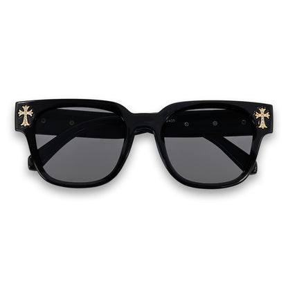 Black sunglasses with gold accents on a white background
