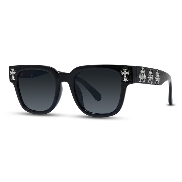 Black sunglasses with decorative arm bands on a white background