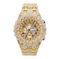Gold watch with diamond-studded face and band on a white background