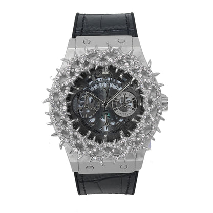 Luxury watch with black leather strap and diamond-studded face on a white background