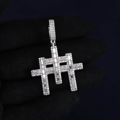Silver cross pendant with clear stones on a black background