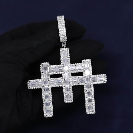 Diamond-studded hashtag pendant held by a gloved hand against a dark background