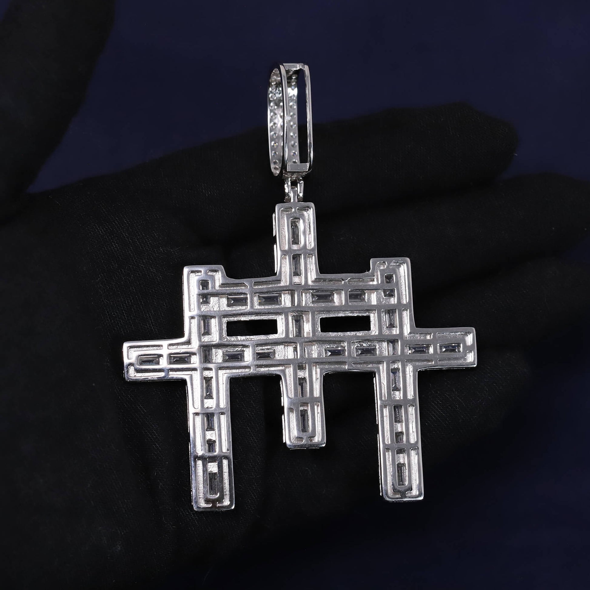 Silver hashtag pendant on a dark background