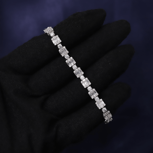 Diamond bracelet on a black gloved hand against a dark background