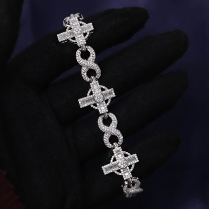 Silver bracelet with cross designs on a dark background
