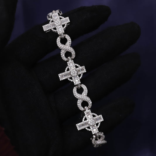 Silver bracelet with cross designs on a dark background