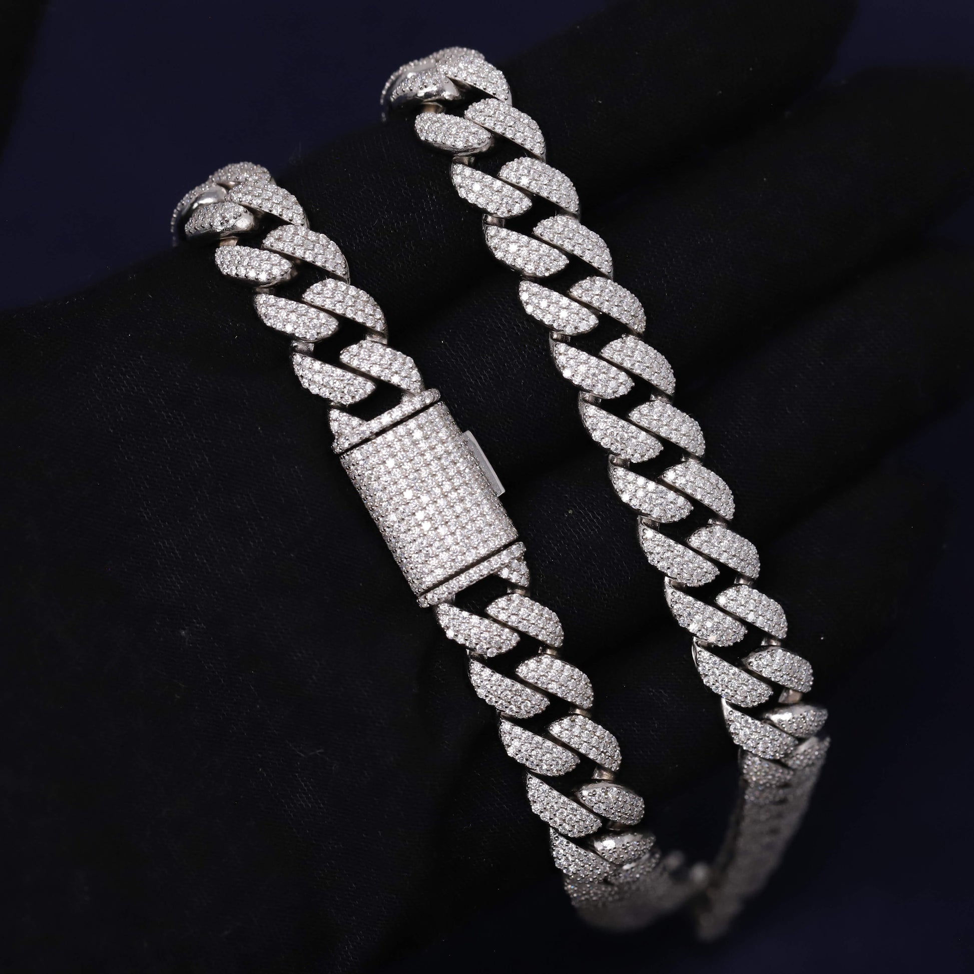 Silver chain bracelet on a dark background