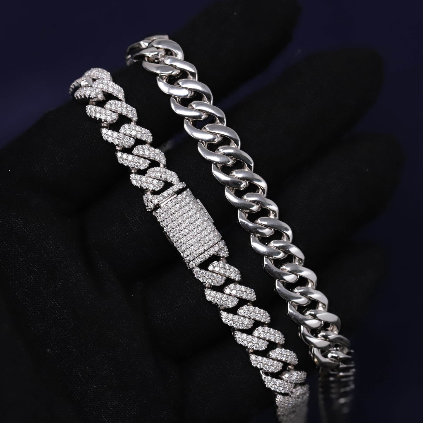 Silver chain bracelet with diamond-like stones on a dark background