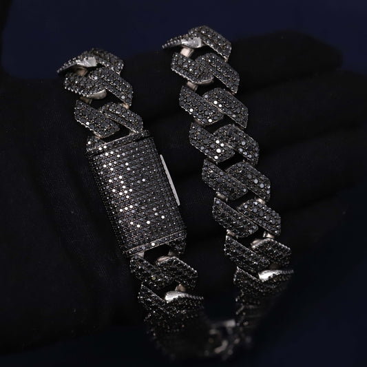 Black chain bracelet with diamond-like stones on a dark background