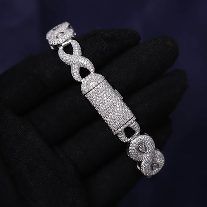 Silver bracelet with intricate design on a dark background