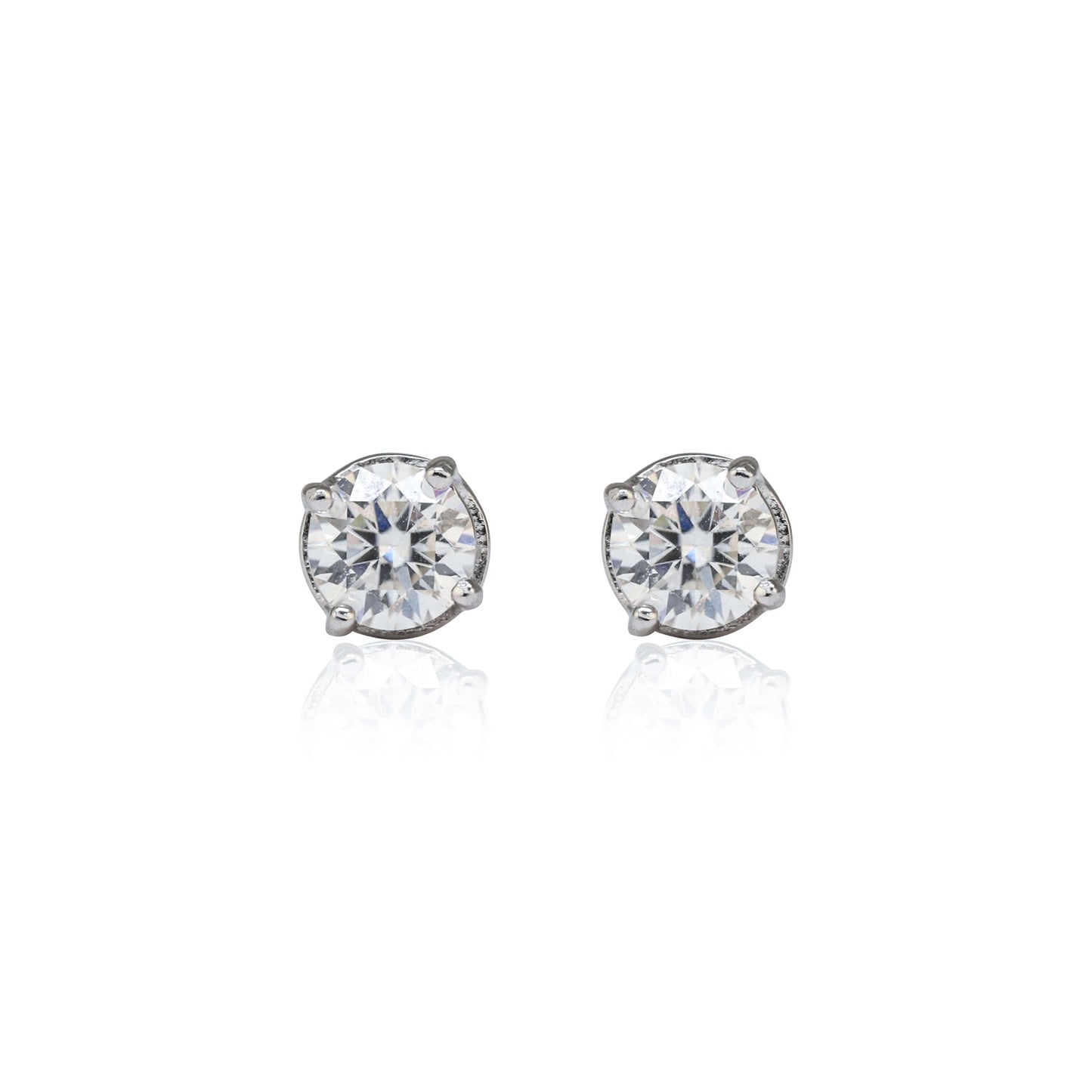5mm round Moissanite solitaire earrings with 1.1ct diamond studs in sterling silver, front view.