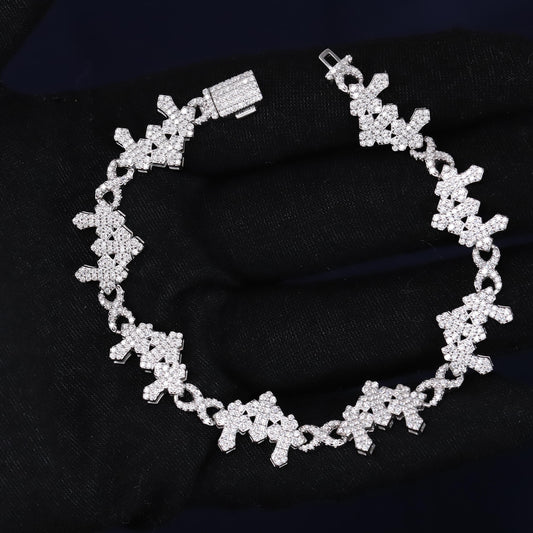 Silver bracelet with floral design on a black fabric background
