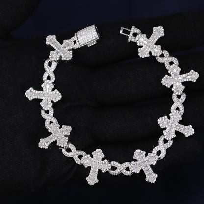 Silver bracelet with cross designs on a black background