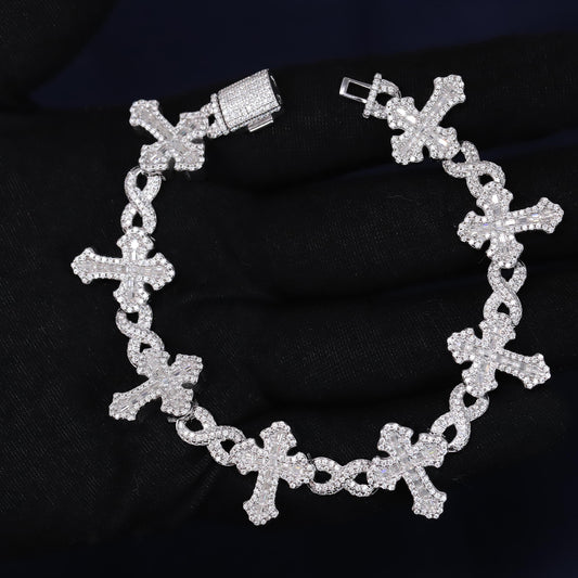 Silver bracelet with cross designs on a black background