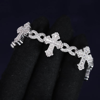 Silver bracelet with cross designs on a black background