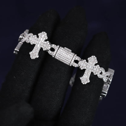 Silver bracelet with cross designs on a black background