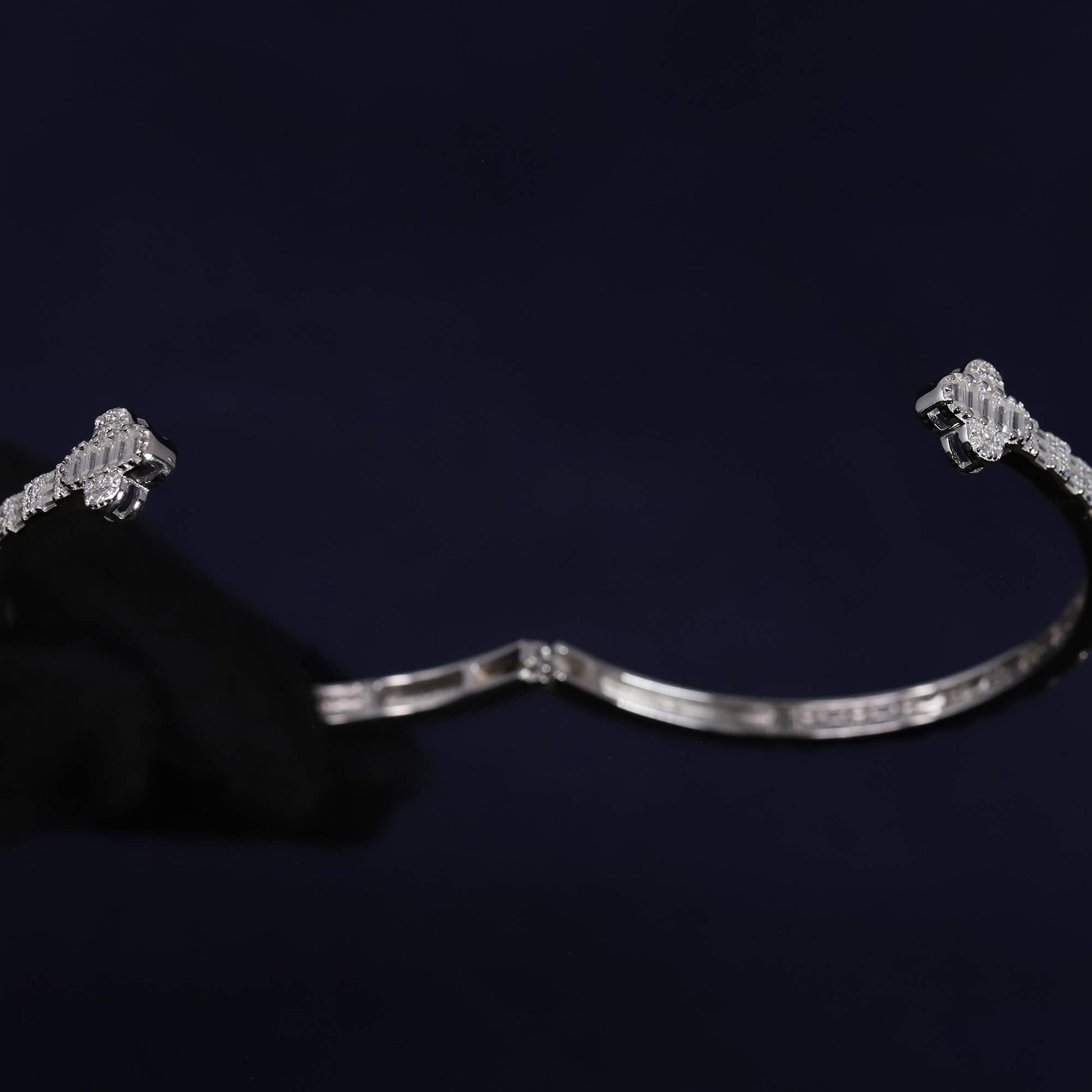 Silver bracelet on a dark background