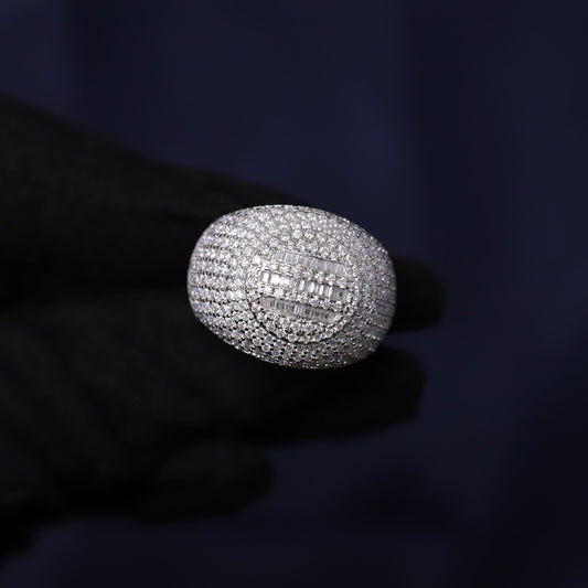 Silver ring with gemstones on a dark background