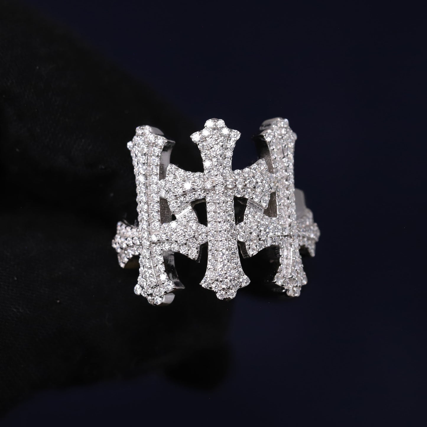 Silver ring with gemstones on a black background