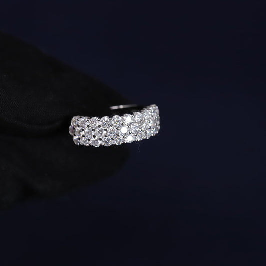 Silver ring with diamonds on a black background