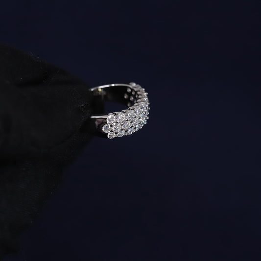 Silver ring with diamonds on a black background