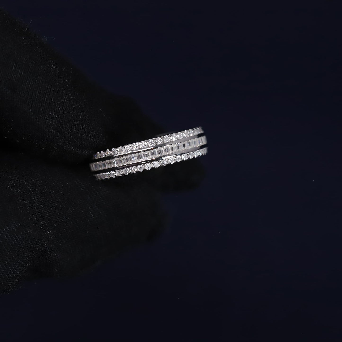 Stack of diamond rings on a black background