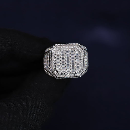Silver ring with gemstones on a dark background