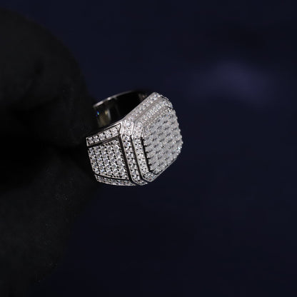 Silver ring with gemstones on a dark background