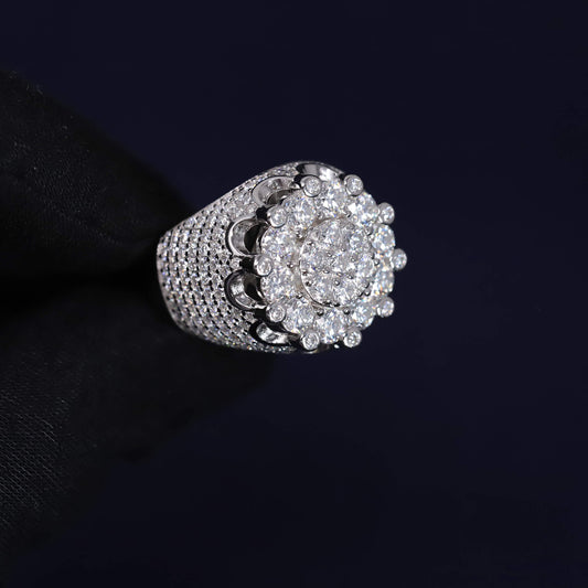 Silver ring with diamond cluster on a black background