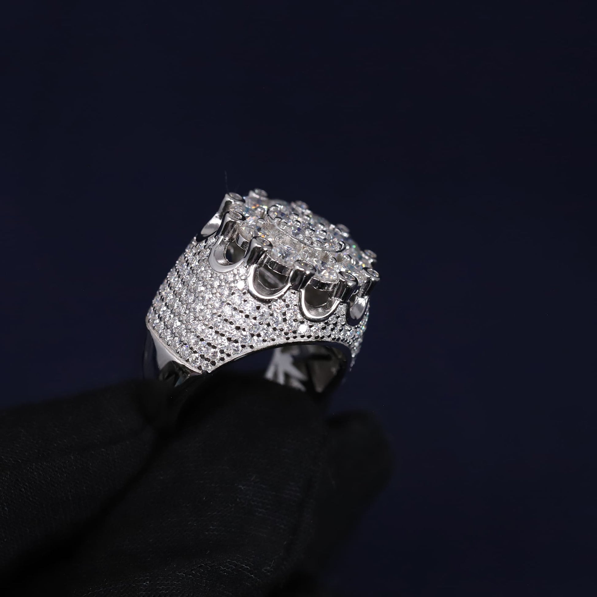 Silver ring with multiple stones on a black background