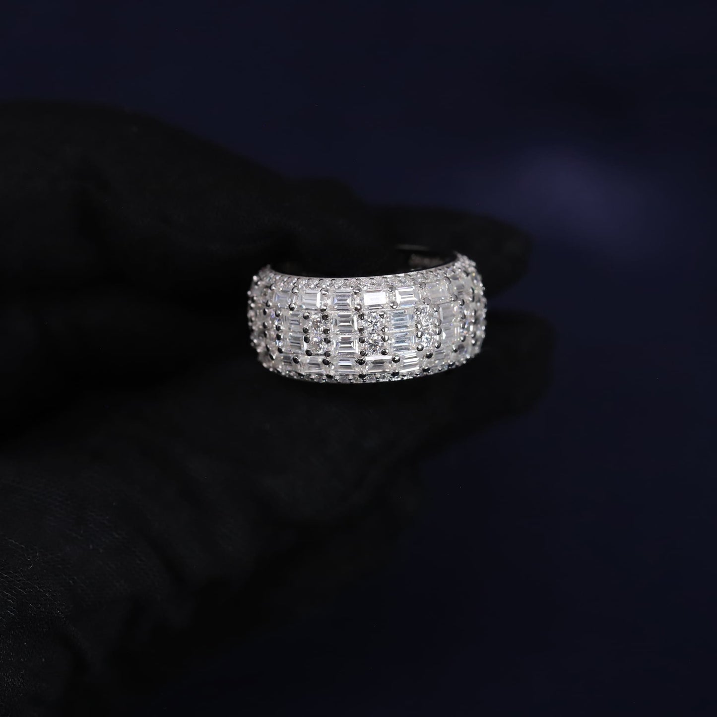 Silver ring with diamonds on a black background