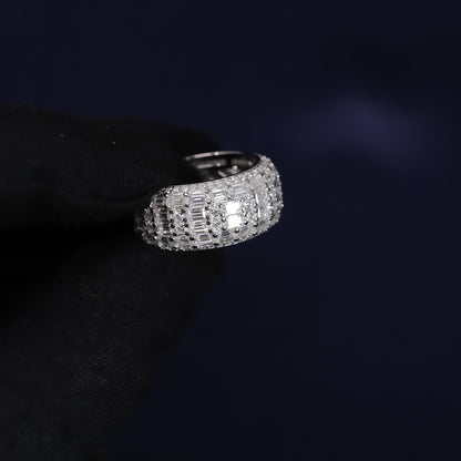 Silver ring with gemstones on a dark background