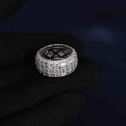 Silver ring with gemstones on a dark background