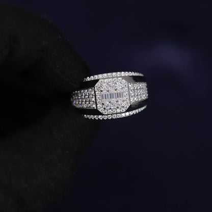 Silver ring with gemstones on a dark background