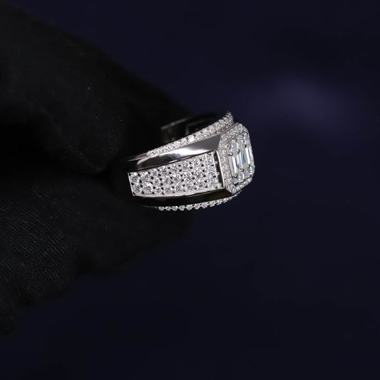 Silver ring with gemstones on a dark background