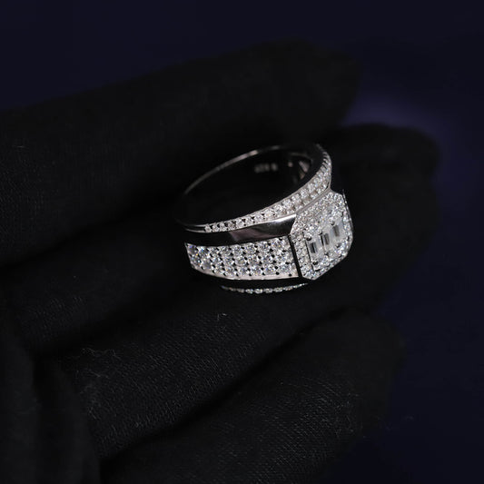 Silver ring with black center on a dark background