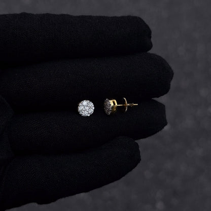 Gold-plated 7mm round moissanite cluster diamond stud earrings with screw backs shown on black glove.
