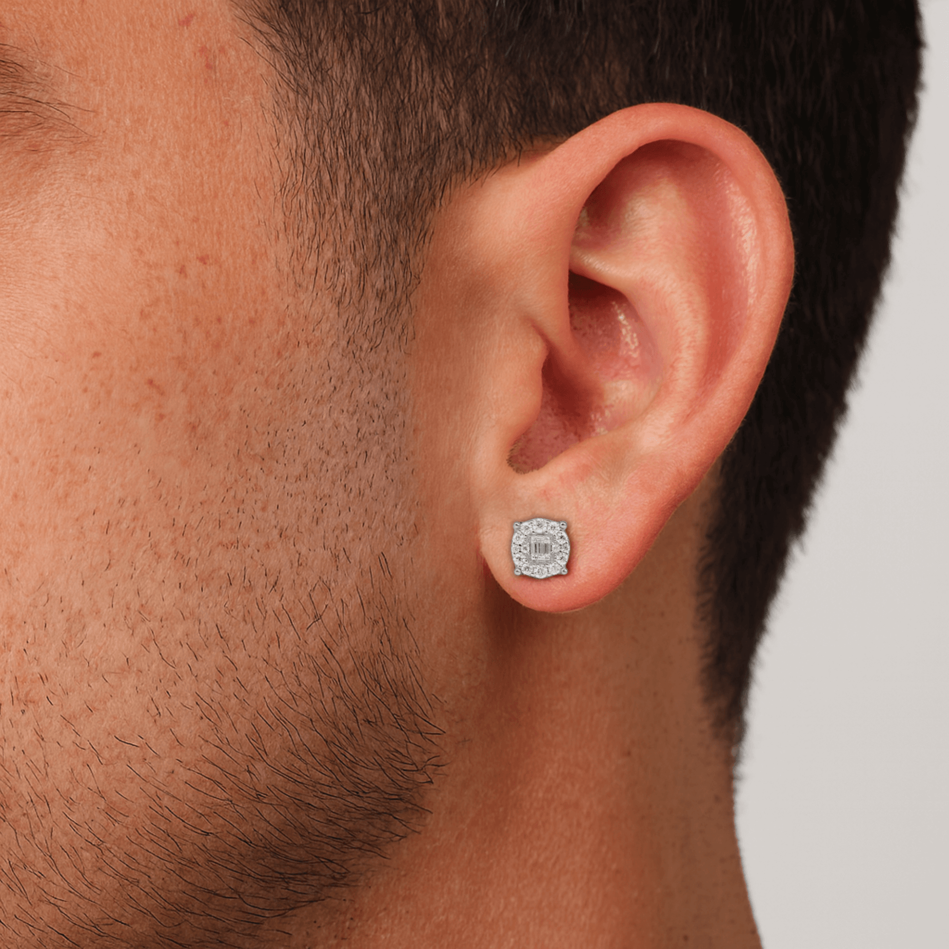 Round moissanite cluster diamond stud earring worn on ear, showing 7mm size and shine.